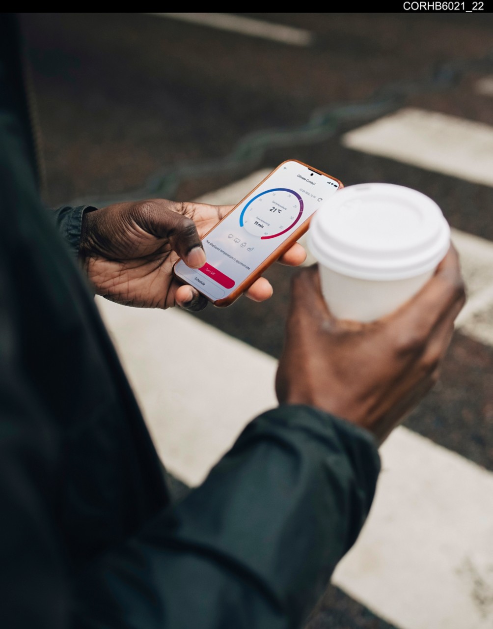 A customer pre-conditions their car’s cabin temperature remotely using the MyToyota app